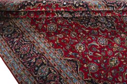 Close-up detail of 2000s Kashan rug from Iran / Persia showing Wool weave