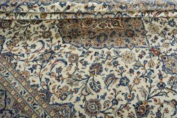 Close-up detail of 2000s Kashan rug from Iran / Persia showing Wool weave