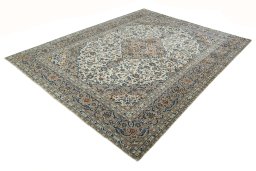 Corner detail of 2000s Kashan rug showing border pattern and Wool pile
