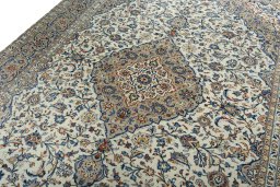 Backside of handmade 2000s Kashan rug showing knot structure and weave density
