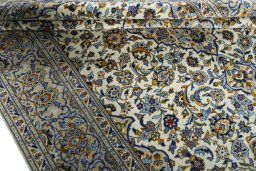 Close-up detail of 2000s Kashan rug from Iran / Persia showing Wool weave