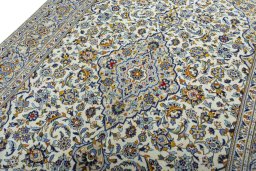 Backside of handmade 2000s Kashan rug showing knot structure and weave density