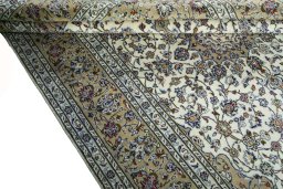 Close-up detail of 2000s Kashan rug from Iran / Persia showing Wool weave
