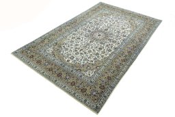 Corner detail of 2000s Kashan rug showing border pattern and Wool pile