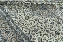Close-up detail of 2000s Kashan rug from Iran / Persia showing Wool weave