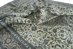 Surface texture of 2000s Kashan rug with natural Wool and intricate pattern
