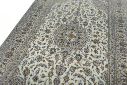 Backside of handmade 2000s Kashan rug showing knot structure and weave density