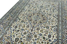Backside of handmade 2000s Kashan rug showing knot structure and weave density