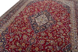 Backside of handmade 2000s Kashan rug showing knot structure and weave density