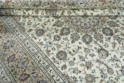 Close-up detail of 2000s Kashan rug from Iran / Persia showing Wool weave