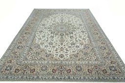 Surface texture of 2000s Kashan rug with natural Wool and intricate pattern