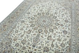 Backside of handmade 2000s Kashan rug showing knot structure and weave density