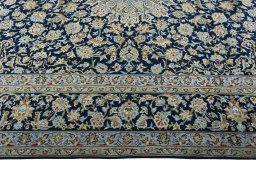 Corner detail of 1970s Kashan rug showing border pattern and Wool pile