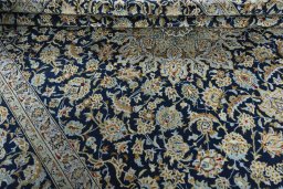 Close-up detail of 1970s Kashan rug from Iran / Persia showing Wool weave
