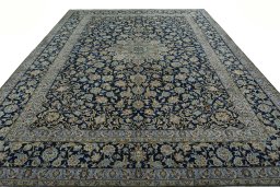 Surface texture of 1970s Kashan rug with natural Wool and intricate pattern