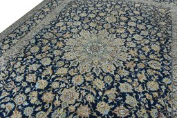 Backside of handmade 1970s Kashan rug showing knot structure and weave density