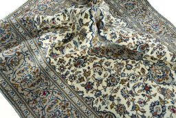 Surface texture of 2000s Kashan rug with natural Wool and intricate pattern