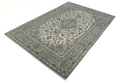 Corner detail of 2000s Kashan rug showing border pattern and Wool pile