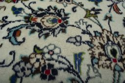 Close-up detail of 2000s Kashan rug from Iran / Persia showing Wool weave