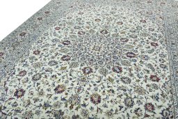 Backside of handmade 2000s Kashan rug showing knot structure and weave density