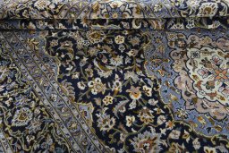 Close-up detail of 2000s Kashan rug from Iran / Persia showing Wool weave