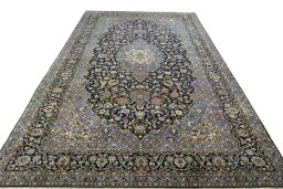 Surface texture of 2000s Kashan rug with natural Wool and intricate pattern
