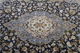 Central medallion detail of 2000s Kashan rug from Iran / Persia