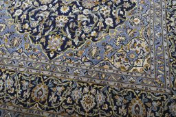 Close-up detail of 2000s Kashan rug from Iran / Persia showing Wool weave