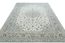Surface texture of 2000s Kashan rug with natural Wool and intricate pattern