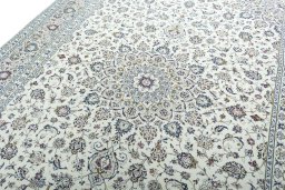 Backside of handmade 2000s Kashan rug showing knot structure and weave density