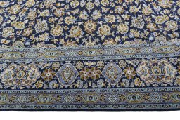 Corner detail of 1970s Kashan rug showing border pattern and Wool pile