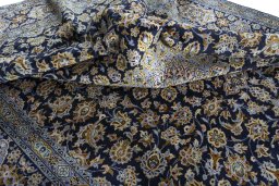 Surface texture of 1970s Kashan rug with natural Wool and intricate pattern