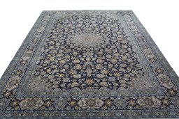 Surface texture of 1970s Kashan rug with natural Wool and intricate pattern