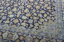 Close-up detail of 1970s Kashan rug from Iran / Persia showing Wool weave