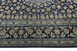 Corner detail of 1970s Kashan rug showing border pattern and Wool pile