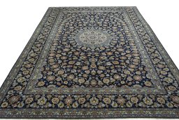 Surface texture of 1970s Kashan rug with natural Wool and intricate pattern