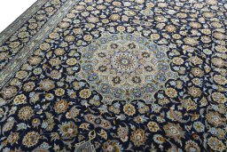Backside of handmade 1970s Kashan rug showing knot structure and weave density