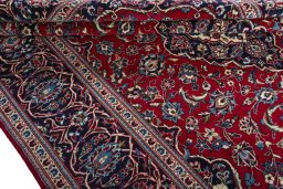 Close-up detail of 2000s Kashan rug from Iran / Persia showing Wool weave