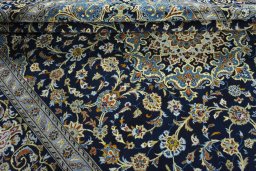Close-up detail of 2000s Kashan rug from Iran / Persia showing Wool weave