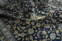 Surface texture of 2000s Kashan rug with natural Wool and intricate pattern
