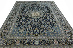 Surface texture of 2000s Kashan rug with natural Wool and intricate pattern