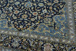 Close-up detail of 2000s Kashan rug from Iran / Persia showing Wool weave