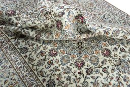 Surface texture of 2000s Kashan rug with natural Wool and intricate pattern