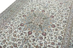Backside of handmade 2000s Kashan rug showing knot structure and weave density