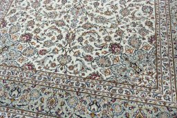 Close-up detail of 2000s Kashan rug from Iran / Persia showing Wool weave