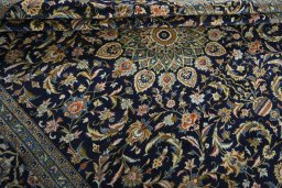 Close-up detail of 2000s Kashan rug from Iran / Persia showing Wool weave