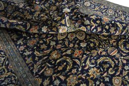 Surface texture of 2000s Kashan rug with natural Wool and intricate pattern