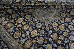 Close-up detail of 2000s Kashan rug from Iran / Persia showing Wool weave