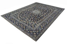Corner detail of 2000s Kashan rug showing border pattern and Wool pile