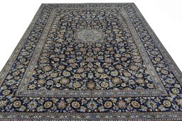 Surface texture of 2000s Kashan rug with natural Wool and intricate pattern